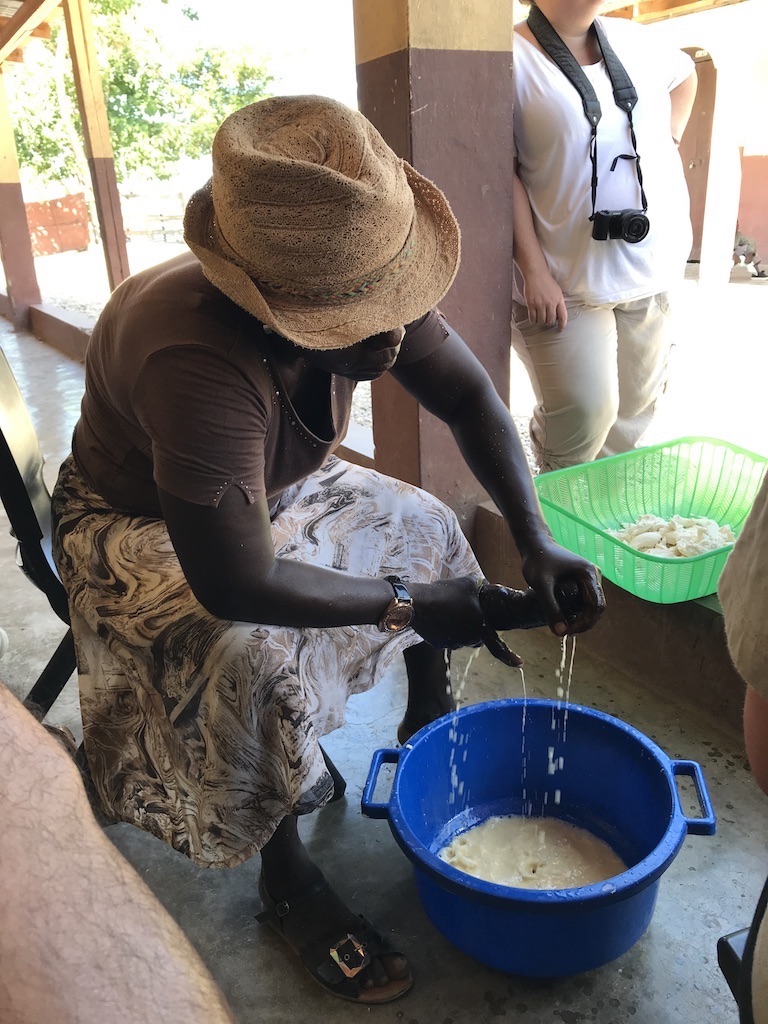 woman squeezing cassava