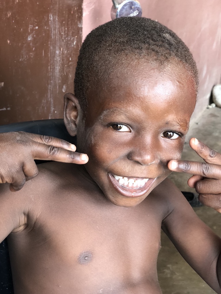 Haitian boy smiling big