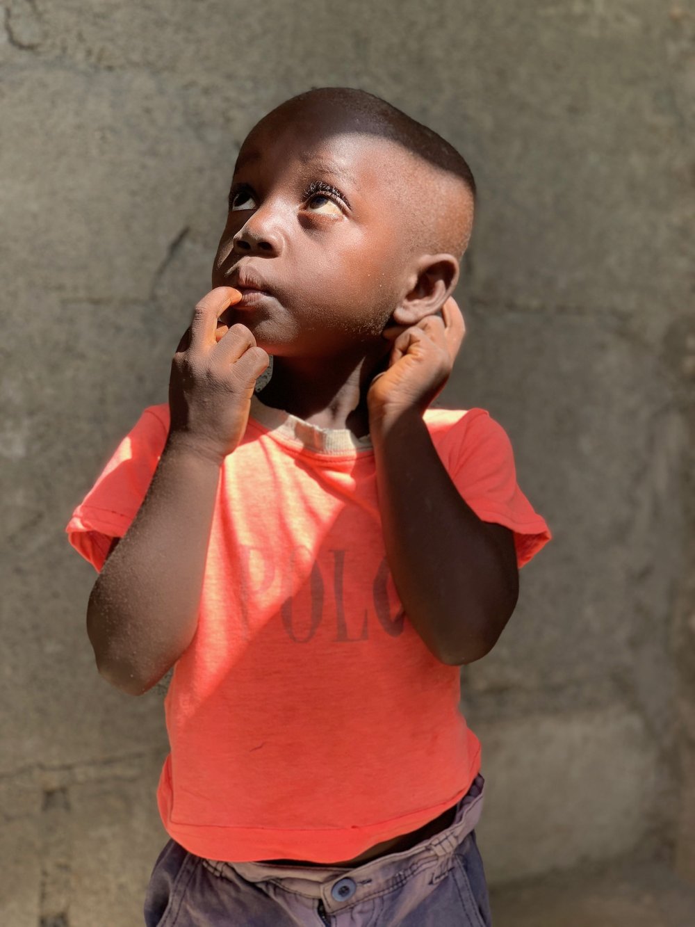 Haitian boy looking up