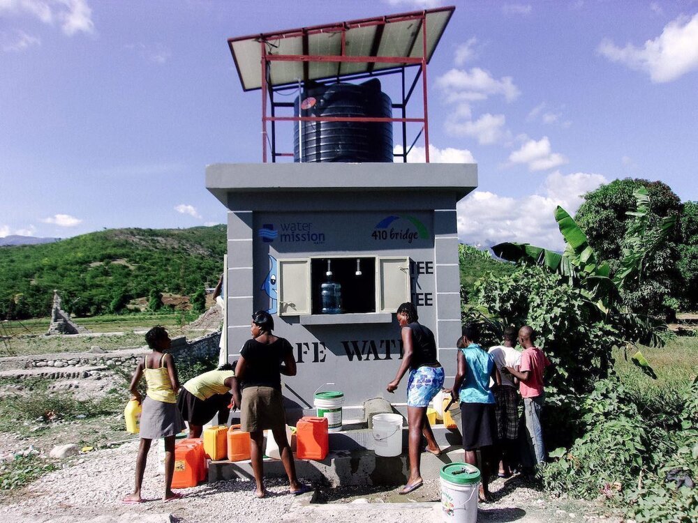 people getting water from well in Haiti