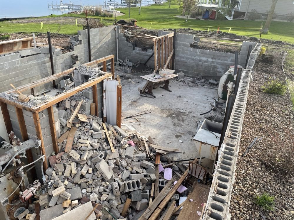 Tearing out the basement and foundation. It took Sam and our dads 1 week to finish!